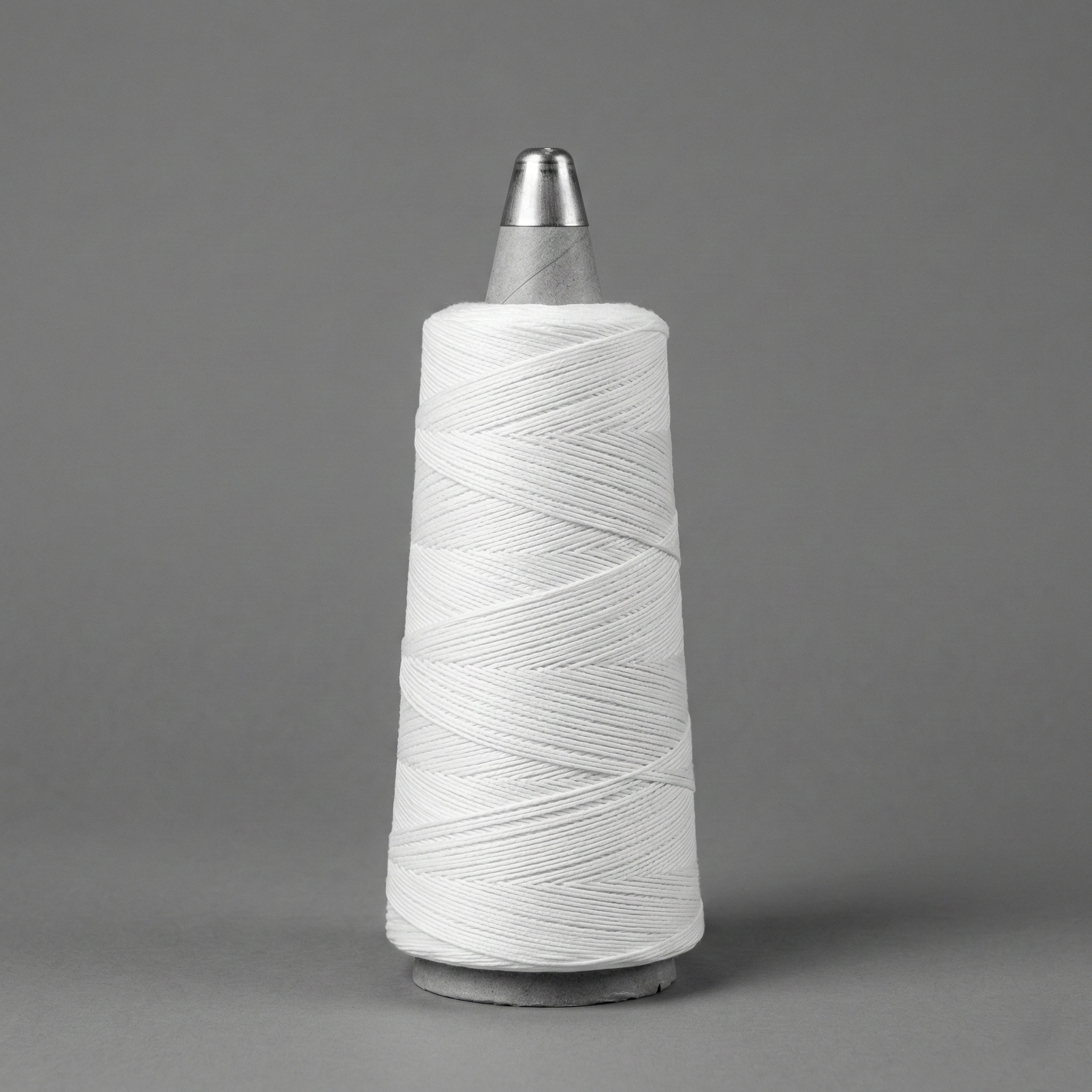 White fiber on a spool.